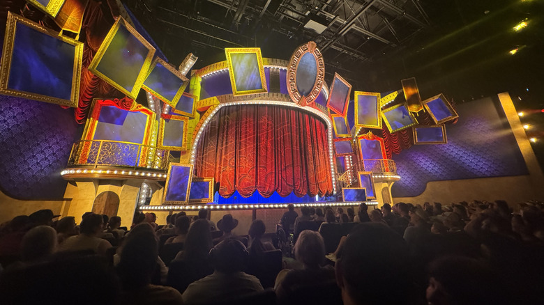 People seated in an auditorium waiting to watch the Villains Ever After show at Disney's Hollywood Studios Park in Orlando