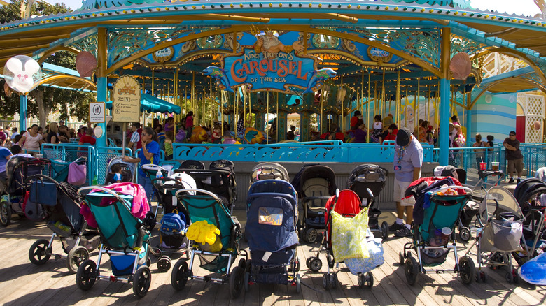 Baby strollers are lined up at the Paradise Pier carousel in Disney's California Adventure Park