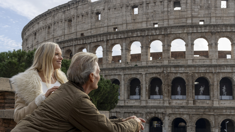 Senior Caucasian couple admiring the Colosseum in Rome