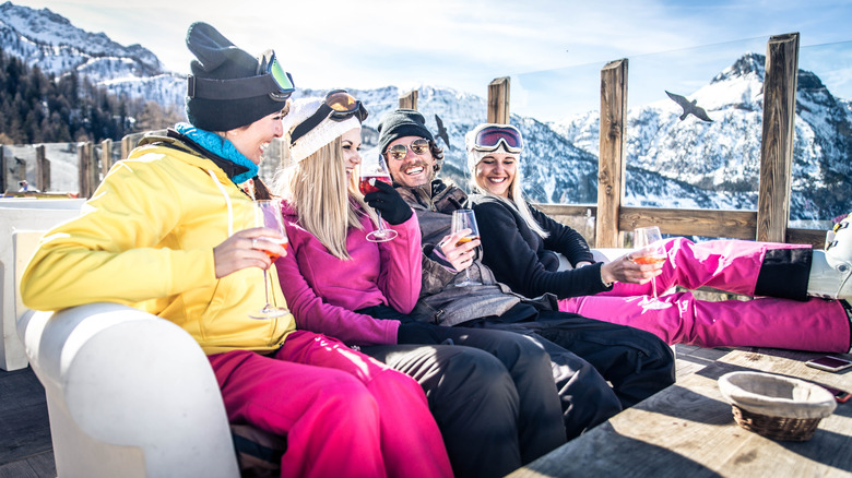 A group of friends enjoying drinks in a ski resort