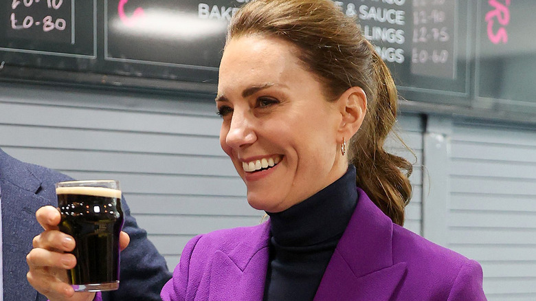 Catherine, Duchess of Cambridge drinks a half pint of Guinness