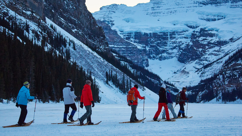 People on a snow shoe tour on the frozen Lake Louise