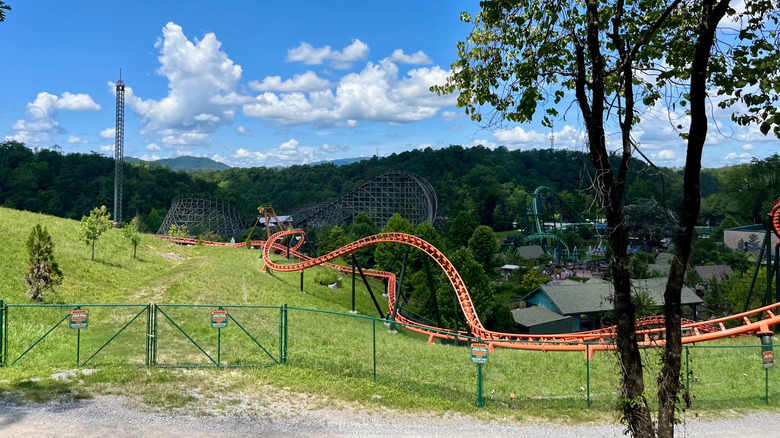 Overhead view of Dollywood, with rides and hilly terrain visible in Pigeon Forge, Tennessee