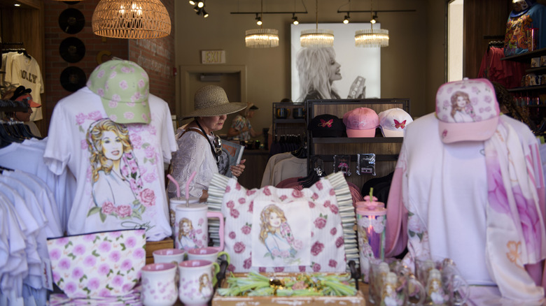 A guest peruses Dolly Parton themed items while visiting Dollywood in Pigeon Forge, Tennessee