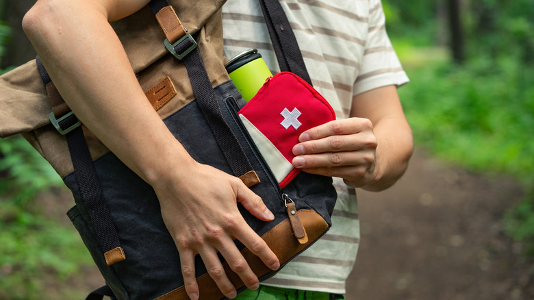 Person with camping essentials