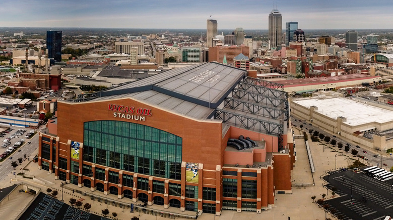 Aerial view of the Colts' Lucas Oil Stadium with Indianapolis skyline in the background