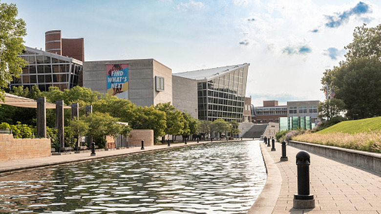 Outdoor scene from downtown Indianapolis with canal walk and Indiana State Museum in view on the left