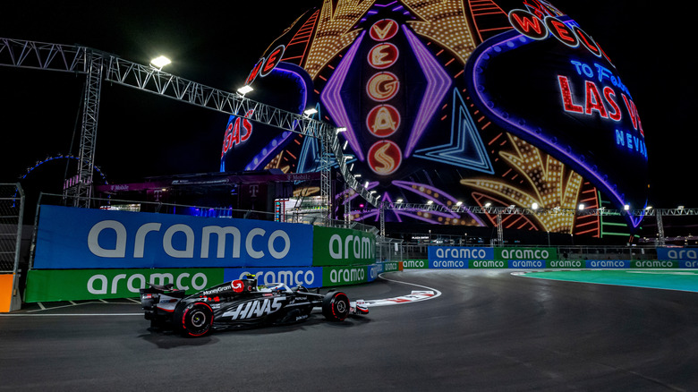 formula one driver next to vegas sphere