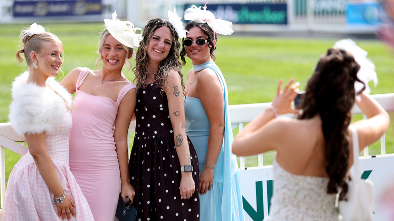 Fashion on show on Ladies Day at Aintree Racecourse