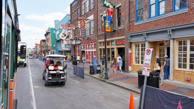 A golf cart on a street in Nashville