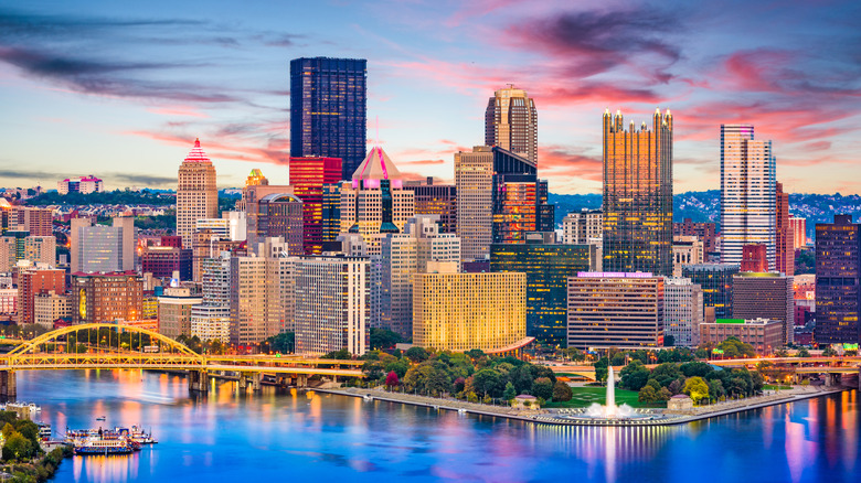 The illuminated downtown skyline of Pittsburgh at sunset