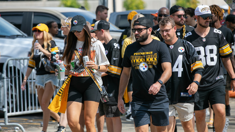 Pittsburgh Steeler fans walking into Acrisure stadium