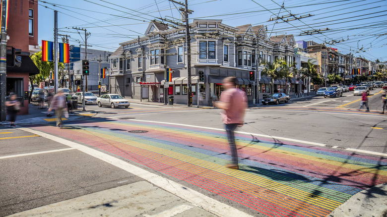 Pedestrians crossing the rainbow crosswalks in the Castro district of San Francisco