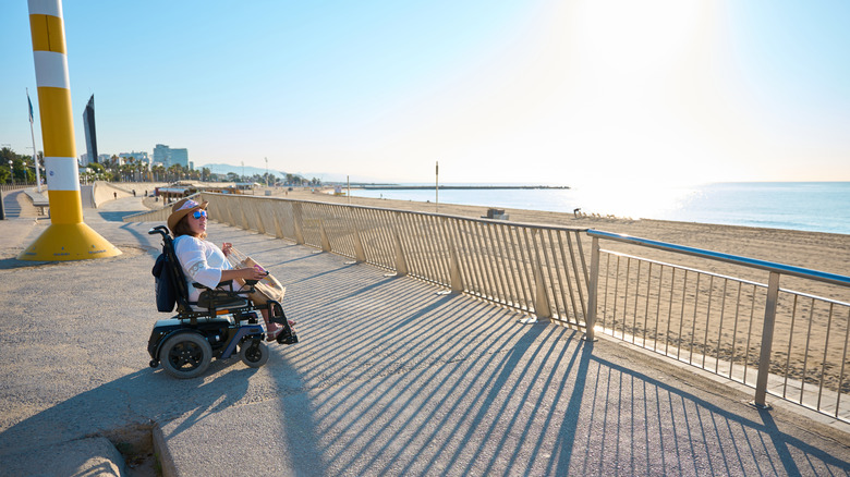 A traveler in a wheelchair enjoying the beach