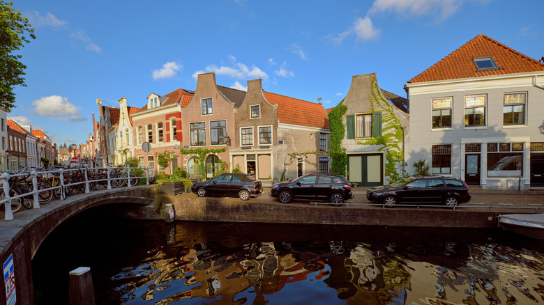 Burgwal Canal in Haarlem on a sunny day lined with old buildings