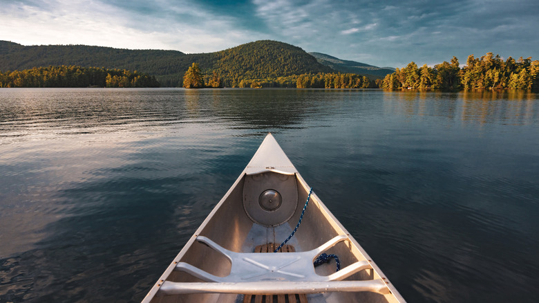 Canoeing on lake in Adirondacks at sunset