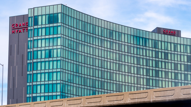 Facade of the the modern Grand Hyatt at SFO with walls of glass windows on a sunny day