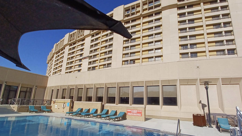 Exterior view of Hyatt Regency hotel at DFW Airport from the pool area on a sunny day