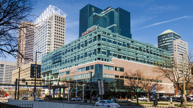 Exterior view of Renaissance Baltimore Harborplace Hotel with modern glass towers facade and skyscrapers in background