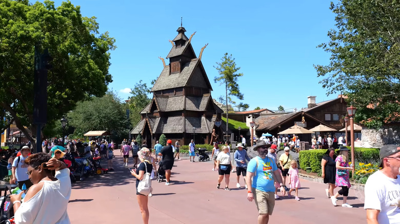 Replica stave church and busy walkways at the Norway pavilion in EPCOT, Florida