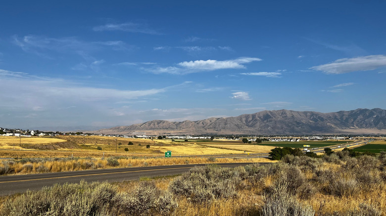 Mountains and houses in Tremonton, Utah as seen from the road