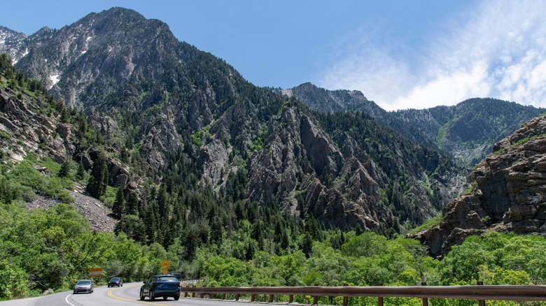 Cars drive along a road near Cottonwood Heights