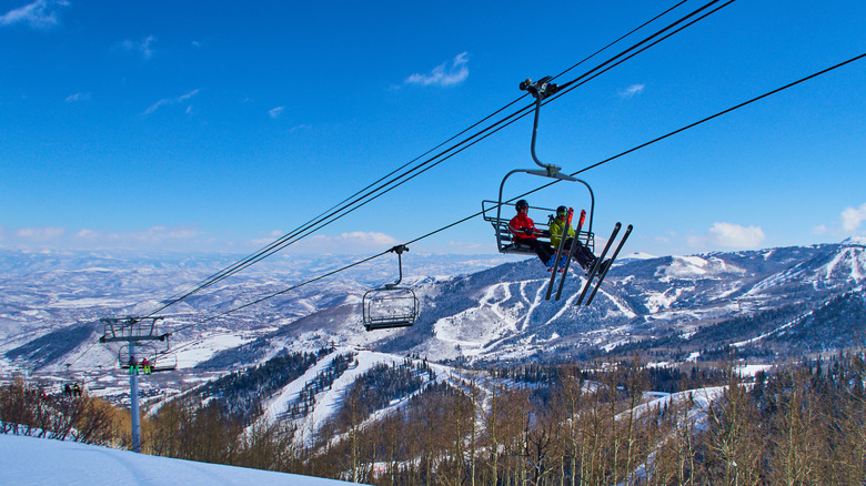 People on a ski chairlift at Park City Mountain in Utah