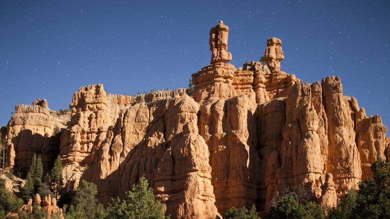 Full moon lights pinnacles in Dixie National Forest on starlit summer night, Cedar City, Utah