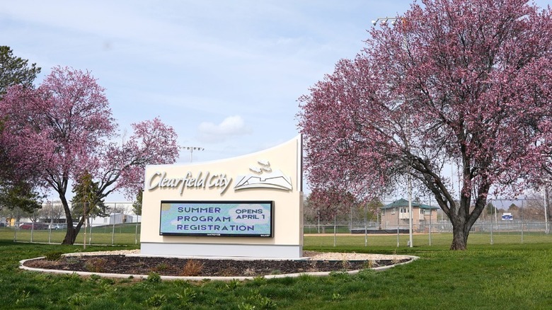 Clearfield City sign among trees