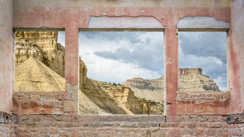 A view of the mountains through the walls of an abandoned building in Sego, Utah
