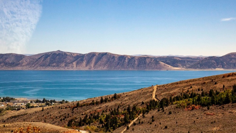 View of Bear Lake with mountains and cloudless sky in background