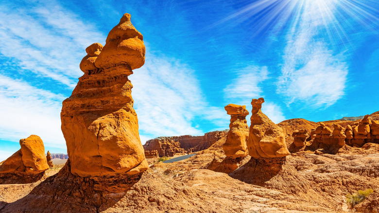 Red hoodoo rock formations blue sky Goblin Valley State Park