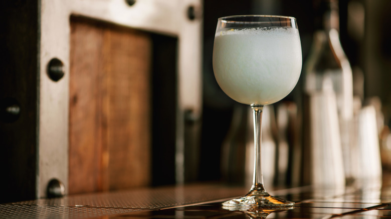 A closeup of a sgroppino cocktail on a bar counter