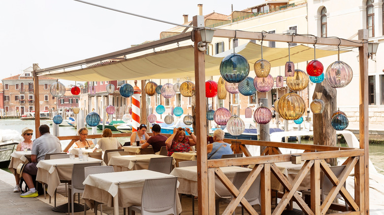 Murano glass ornaments decorate a restaurant terrace on the island of Murano