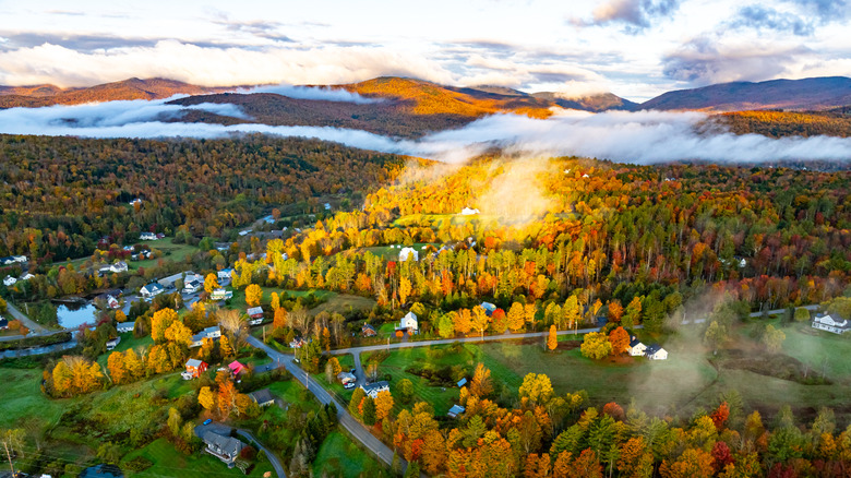 An autumnal aerial view of Route 100 through Stowe, Vermont