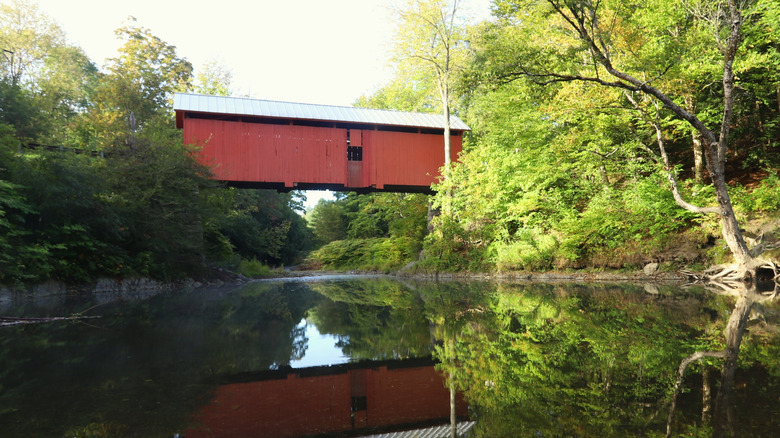 A covered bridge on a sunny autumn day in Northfield, Vermont