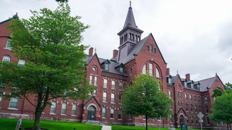 The large, brick Old Mill building on the campus of UVM