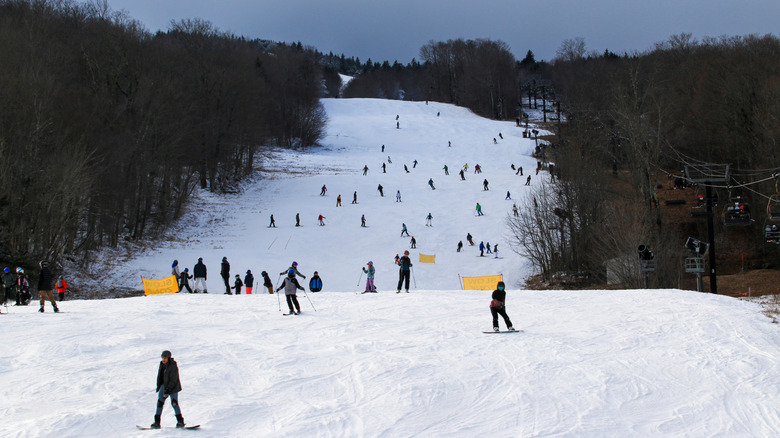 Skiiers on the white slopes of Mount Snow in Vermont
