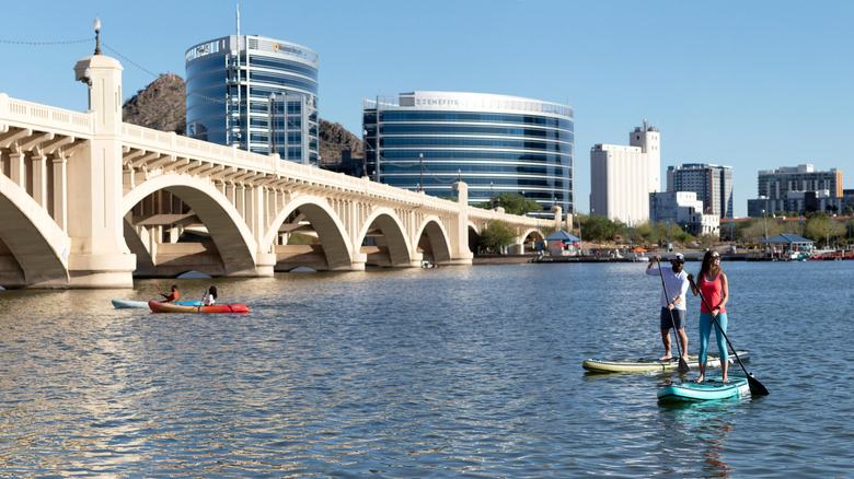 picture of lakefront bridge and paddleboarders in Tempe