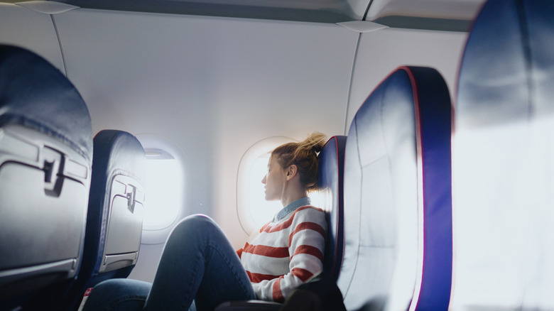 Woman sitting at a window seat