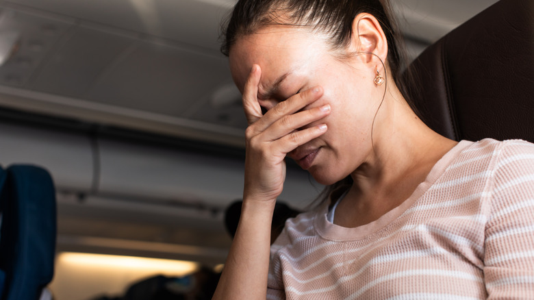 Distressed woman on plane