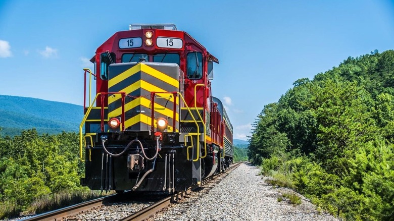 A Virginia Scenic Railway train cutting through the mountains