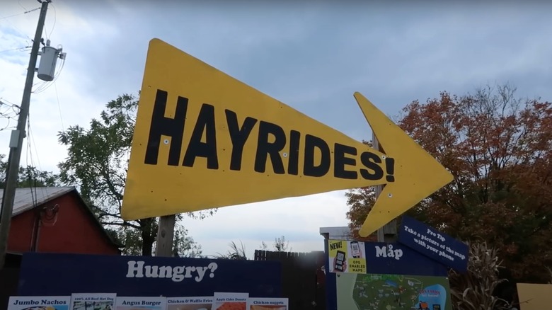 Hay rides sign at fall festival
