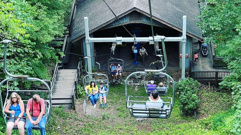 Tourists ride a chairlift over the canopy at Natural Tunnel State Park, Virginia.
