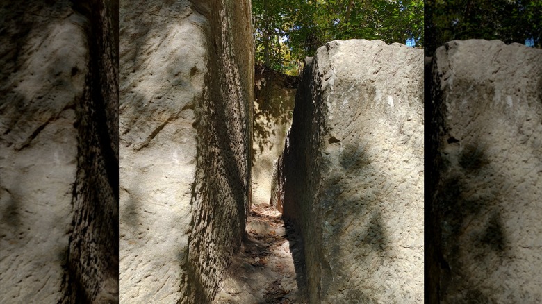 A narrow, carved passage through towering white rocks at Government Island