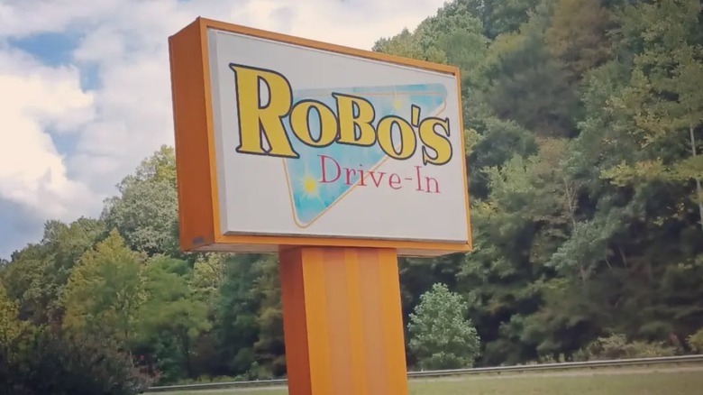 Robos Drive In sign blue sky