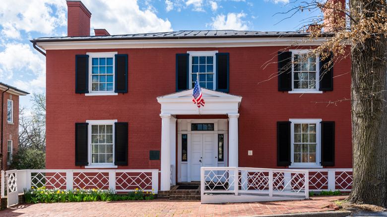 The red facade of the Manse in Staunton, Virginia, on a sunny day