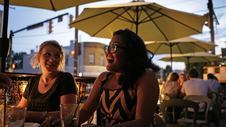 People dining on a patio in Carytown