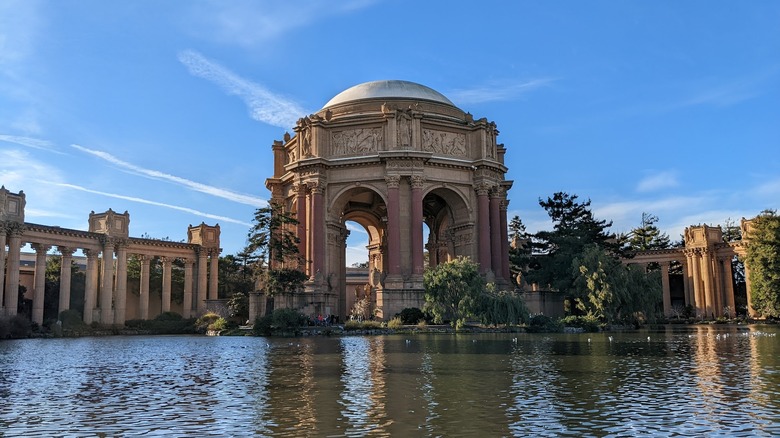 A roman-style domed structure with columns next to a shallow pond near the Presidio in San Francisco.