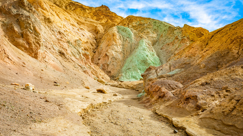 A trail leads through the chromatic landscapes of Desolation Canyon
